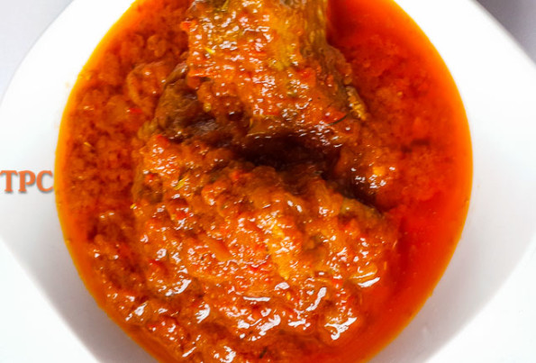 easy nigerian tomato stew in a bowl with chicken