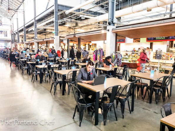 people sitting in the food court of Calgary farmes' market